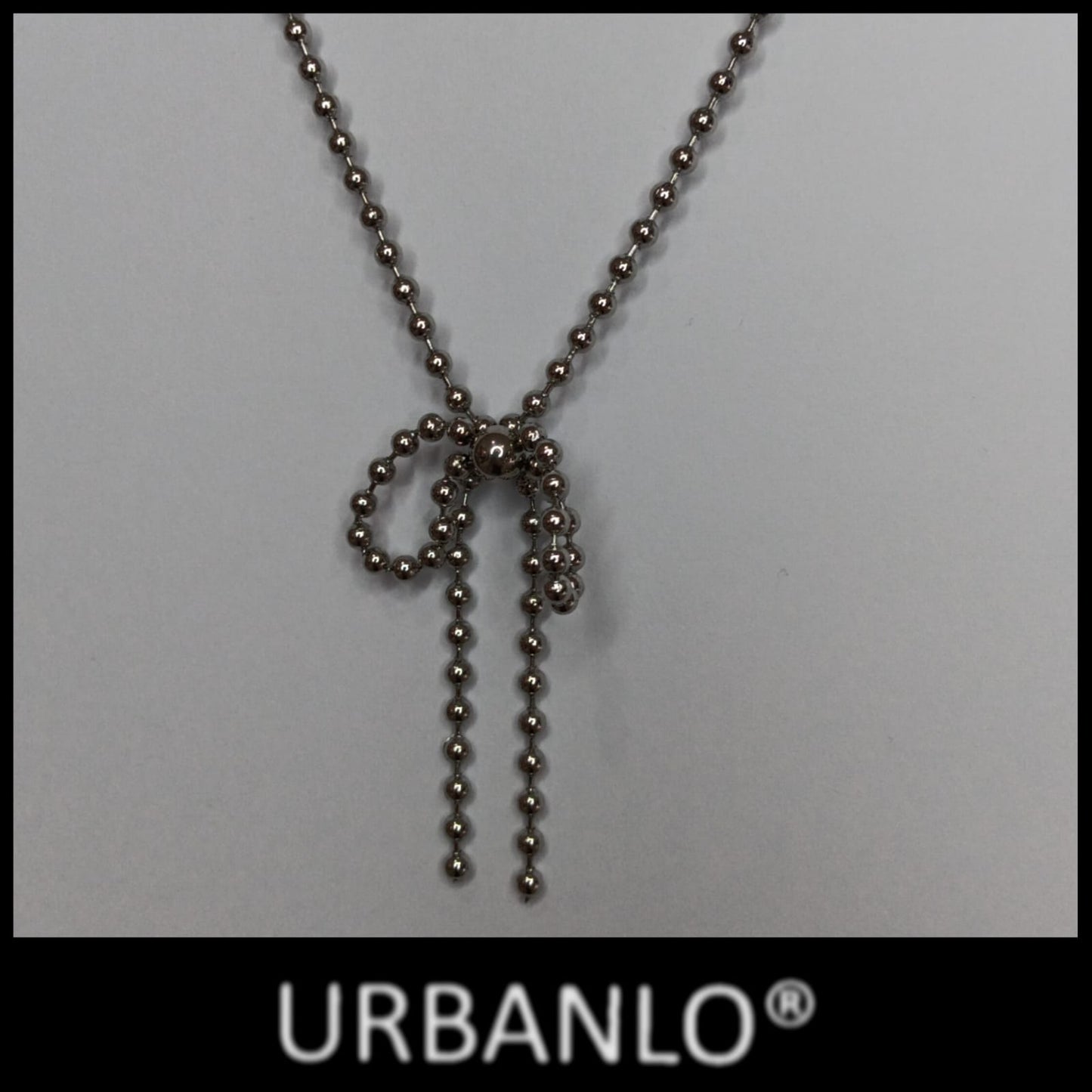 Collana in Acciaio con catena a pallini e pendente a fiocco