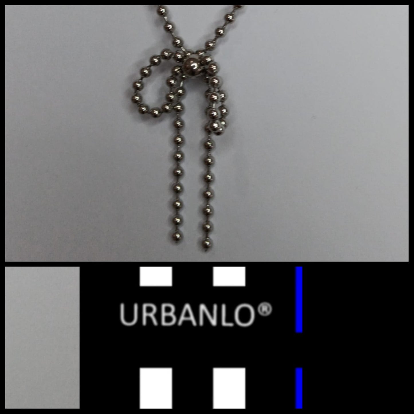 Collana in Acciaio con catena a pallini e pendente a fiocco