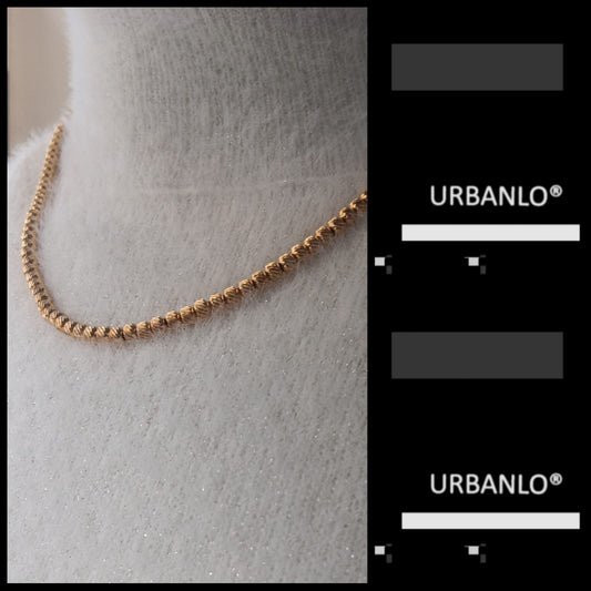 Collana in Acciaio dorato perline striate